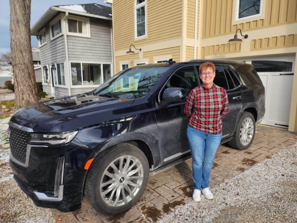 Amy with her Cadillac Escalade